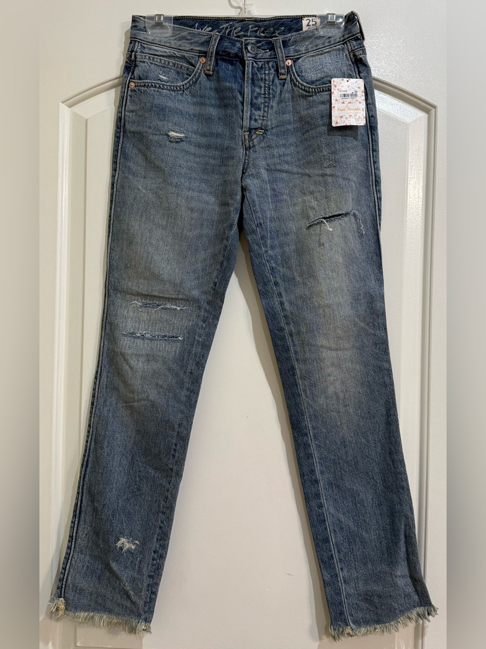 We The Free by Free People Distressed Lught Denim. Raw frayed hem. Size 25. NWT